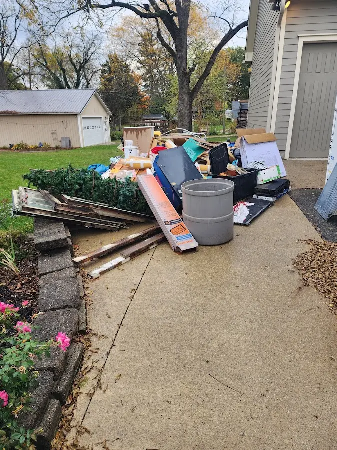 Dumpster being loaded with debris for 30 Yard Dumpster Rental in Newington